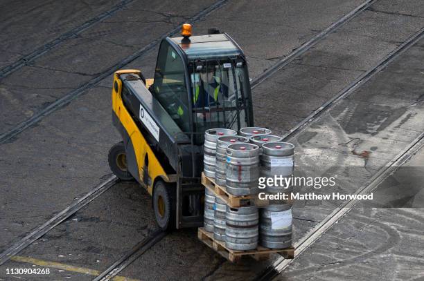 Forklift truck loads barrels of beer onto a ship at the Port of Southampton on February 10, 2019 in Southampton, England. The Port of Southampton is...