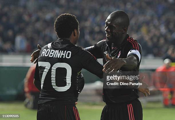 Robinho of Milan celebrates with is team mates Clarence Seedorf after scoring his opening goal during the Serie A match Brescia Calcio and AC Milan...