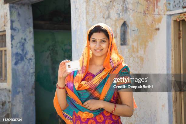 portrait indian woman in sari at village - stock image - showing id stock pictures, royalty-free photos & images
