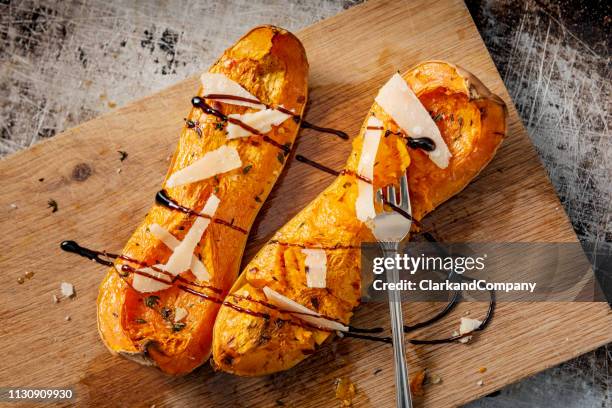 baked butternut squash with parmesan cheese and balsamic vinegar. - balsamic vinegar stock pictures, royalty-free photos & images