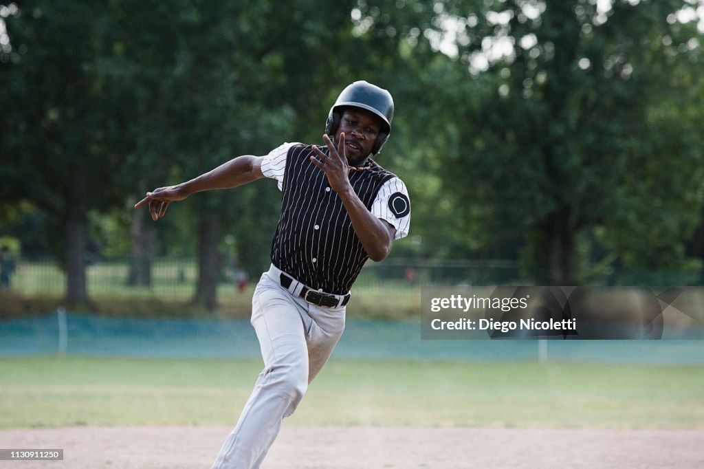 Baseball player runs to the second-base