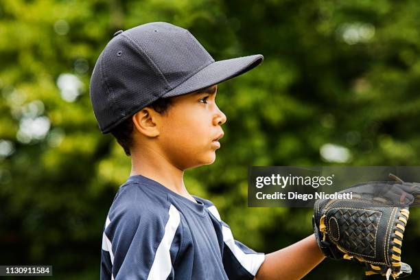 young boy plays baseball, waif for the ball - waif like stock pictures, royalty-free photos & images