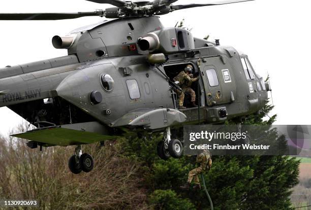 Royal Marines take part in an exercise as Prince Harry, Duke of Sussex, Captain General of the Royal Marines visits 42 Commando Royal Marines at...