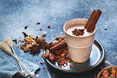 Chai Masala Tea in rustic cup with spices
