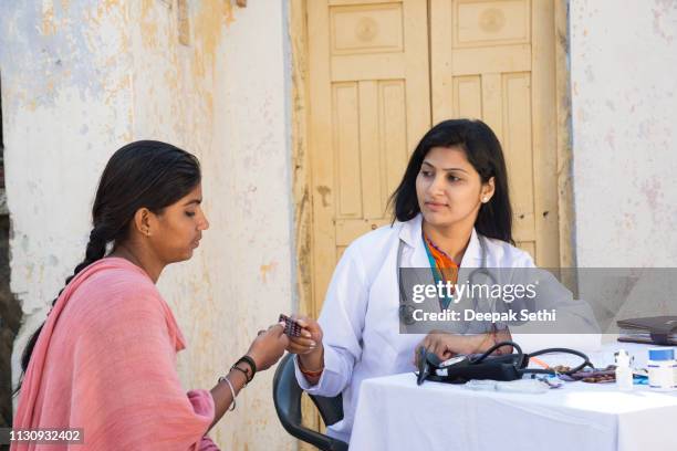 doctor doing social service in village - indian village hospital stock pictures, royalty-free photos & images
