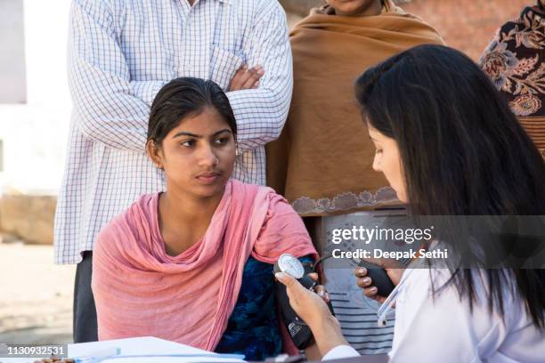doctor doing social service in village - india hospital stock pictures, royalty-free photos & images