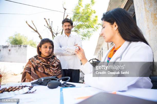 doctor doing social service in village - indian village hospital stock pictures, royalty-free photos & images