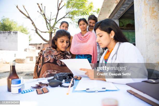 doctor doing social service in village - india hospital stock pictures, royalty-free photos & images