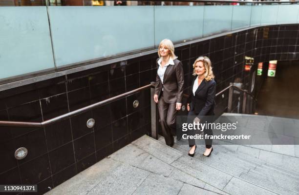 business colleagues walking on the city - sydney metro stock pictures, royalty-free photos & images