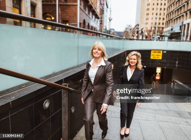 business colleagues walking on the city - 80s business women stock pictures, royalty-free photos & images