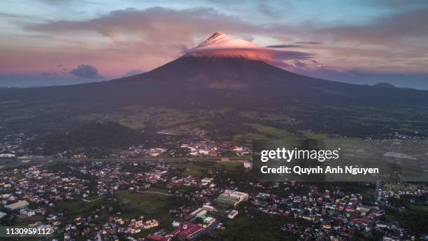 sunrise over mayon volcano and legazpi city - philippines volcano stock pictures, royalty-free photos & images