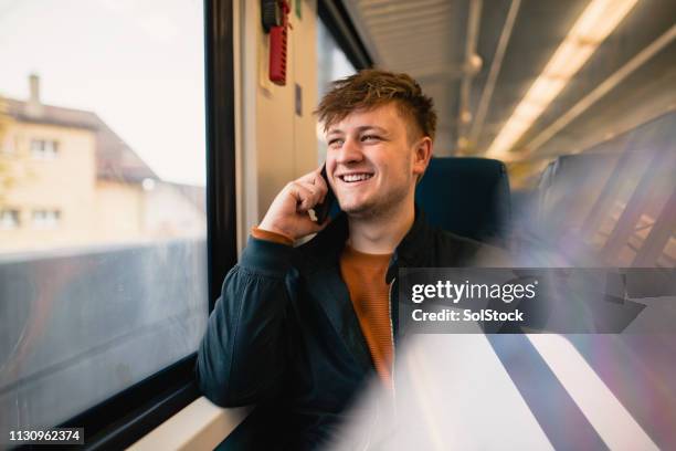 using the phone while travelling - switzerland train stock pictures, royalty-free photos & images