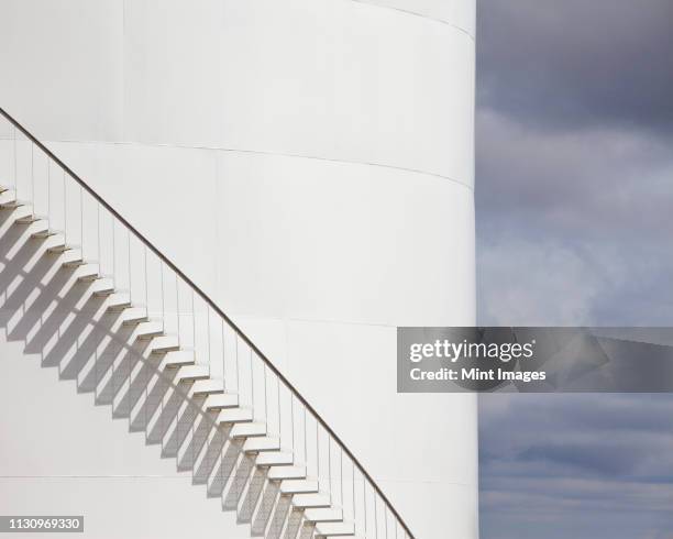 staircase on an oil tank - oil refinery stock pictures, royalty-free photos & images