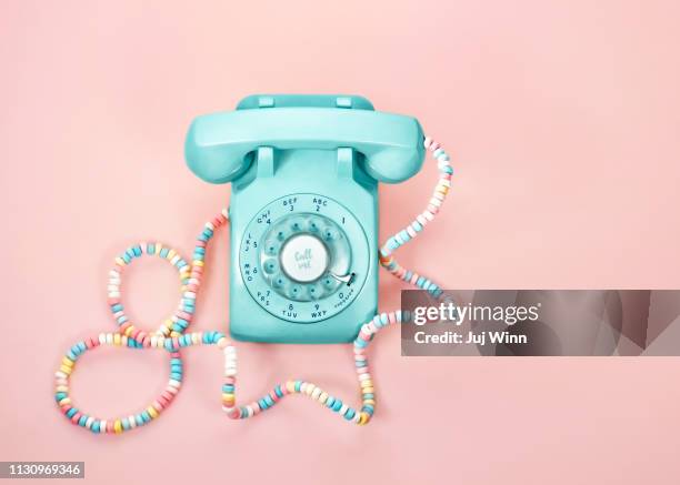 vintage phone with candy cord - old fashioned candy stock pictures, royalty-free photos & images