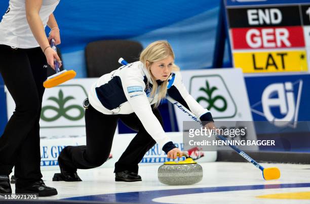 Scotland's player compete in the first round match Japan vs. Scotland at the LGT World Women's Curling Championship in Silkeborg, Denmark, on March...