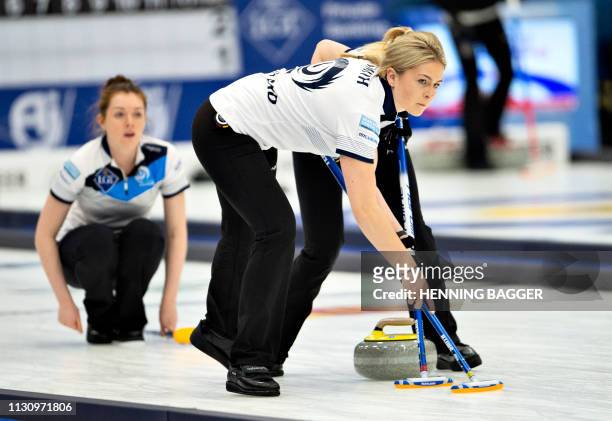 Scotland's players compete in the first round match Japan vs. Scotland at the LGT World Women's Curling Championship in Silkeborg, Denmark, on March...