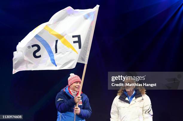 Peter Schroecksnadel, president of ÖSV, waves the FIS flag next to Gian Franco Kasper, president of FIS, during the opening ceremony for the FIS...