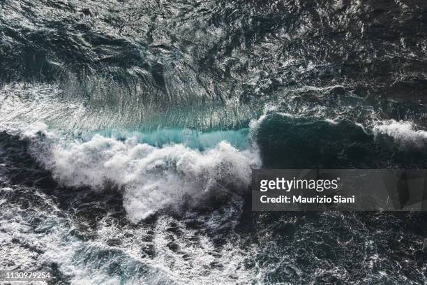 aerial view of waves - gezeiten stock-fotos und bilder