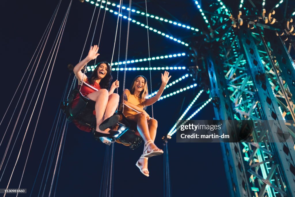 Friends on chain swing ride