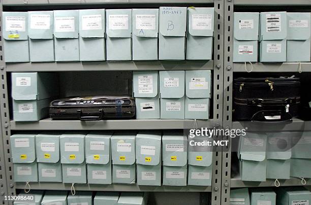 March 4, 2004 - Evidence from the 1994 Rwanda genocide, including some suitcases of the accused, is kept in a locked room in the basement of the...