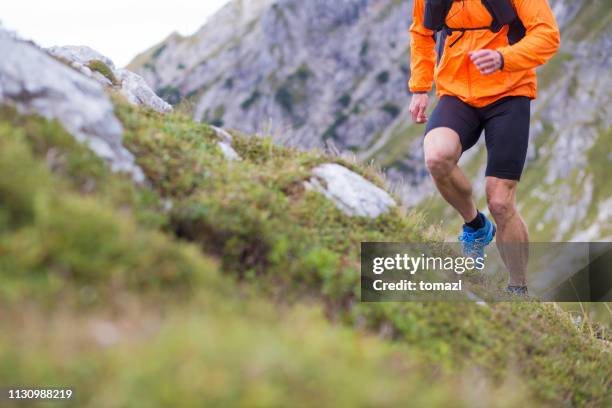 mountain running close-up men - endurance run stock pictures, royalty-free photos & images