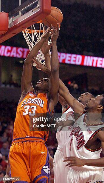 Clemson's Akin Akingbala has a shot blocked by Maryland's Jamar Smith right, and Travis Garrison center, during the first half of Tuesday night's...