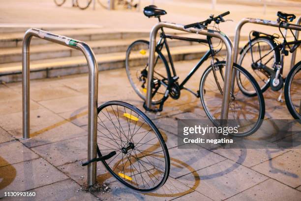 stolen bicycle - only one wheel left - up on a roof stockfoto's en -beelden