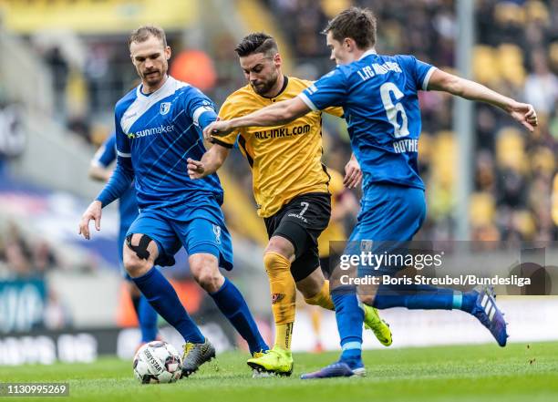 Niklas Kreuzer of Dynamo Dresden In action with Jan Kirchhoff and Björn Rother of 1. FC Magdeburg during the Second Bundesliga match between SG...