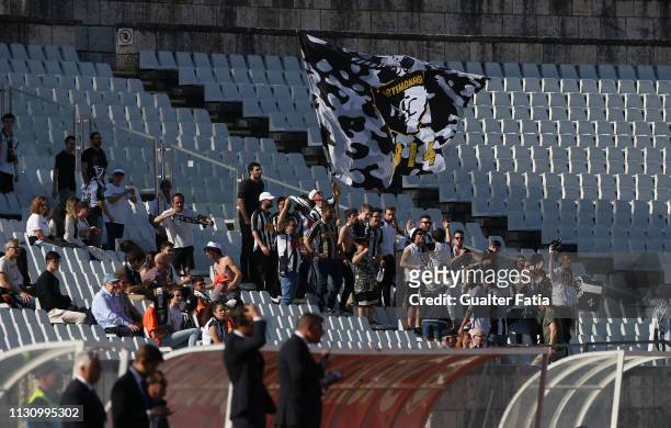 Portimonense SC fans cheer their team during the Liga NOS match between Belenenses SAD and Portimonense SC at Estadio Nacional on March 16, 2019 in...