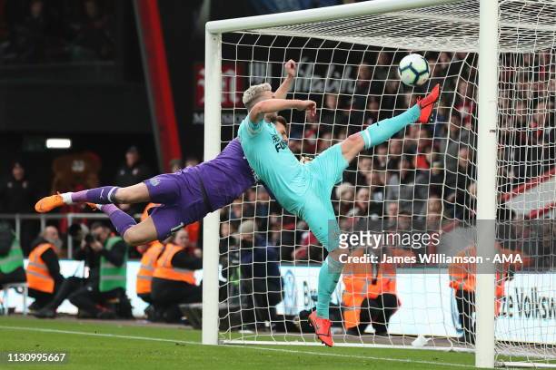 Paul Dummett of Newcastle United clears the header of Nathaniel Clyne of Bournemouth off the line during the Premier League match between AFC...