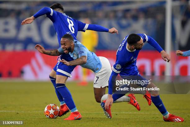 Daniel Caligiuri and Nabil Bentaleb of Schalke challenges Raheem Sterling of Manchester City during the UEFA Champions League Round of 16 First Leg...