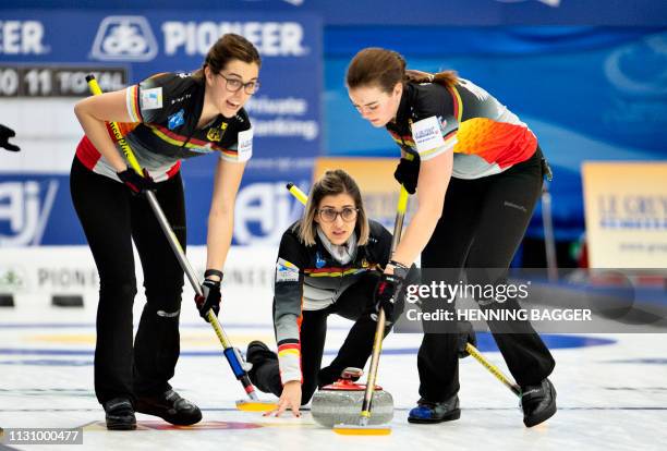 German players compete in the first round match Germany vs. Latvia at the LGT World Women's Curling Championship in Silkeborg, Denmark, on March 16,...