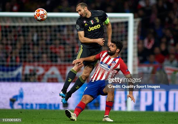 Diego Costa of Atletico de Madrid competes for the ball with Giorgio Chiellini of Juventus during the UEFA Champions League Round of 16 First Leg...