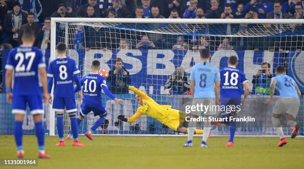 Nabil Bentaleb of Schalke scores the 2nd goal by penalty kick during the UEFA Champions League Round of 16 First Leg match between FC Schalke 04 and...