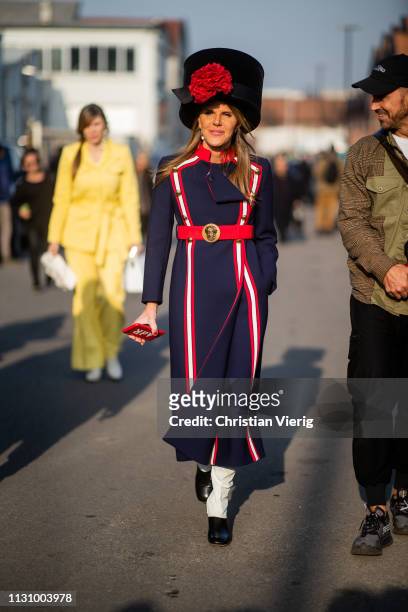 Anna dello Russo is seen wearing navy red white striped coat, black hat outside Gucci on Day 1 Milan Fashion Week Autumn/Winter 2019/20 on February...