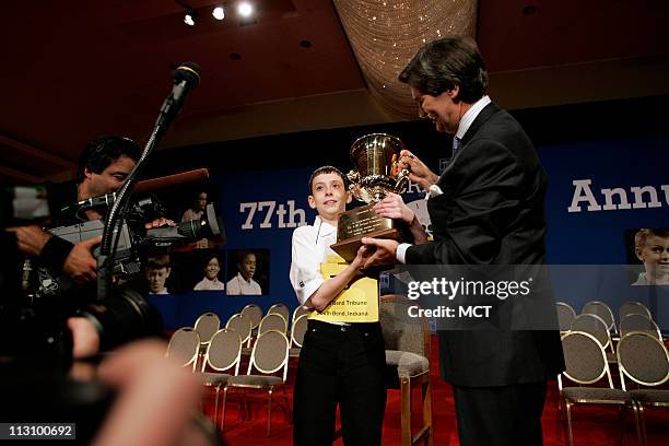 David Scott Tidmarsh of South Bend, Indiana holds up his trophy after he won the 77th National Spelling Bee on Thursday, June 3 in Washington, D.C.