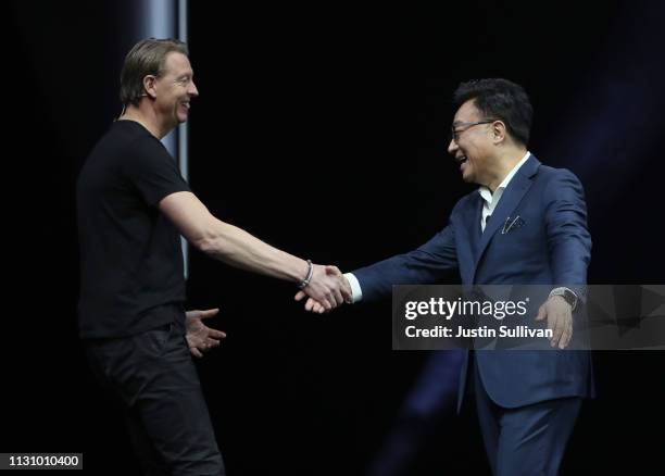 Verizon CEO Hans Vestberg greets Samsung's Mobile Division President and CEO DJ Koh during the Samsung Unpacked event on February 20, 2019 in San...