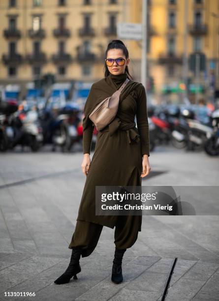 Doina Ciobanu is seen wearing olive dress, beige fanny bag outside Alberta Ferretti on Day 1 Milan Fashion Week Autumn/Winter 2019/20 on February 20,...