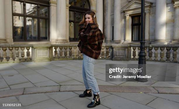 Sonja Paszkowiak wearing Mango jacket, ASOS top, Levi’s 501 jeans, Balenciaga shoes and Saint Laurent bag on February 18, 2019 in Hamburg, Germany.