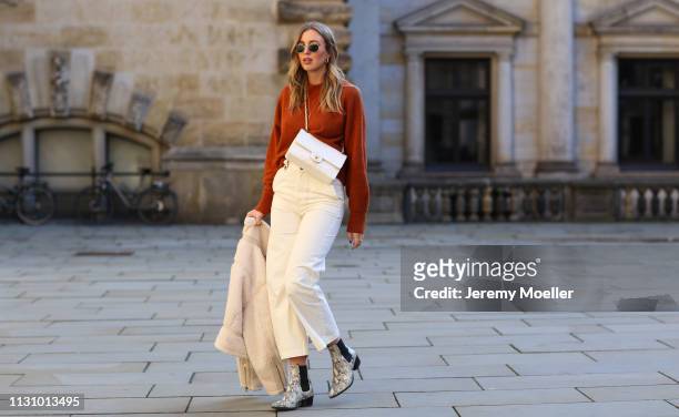 Kira Tolk wearing jacket, sweater and trousers from &otherstories, Chanel bag and Vagabond shoes on February 18, 2019 in Hamburg, Germany.
