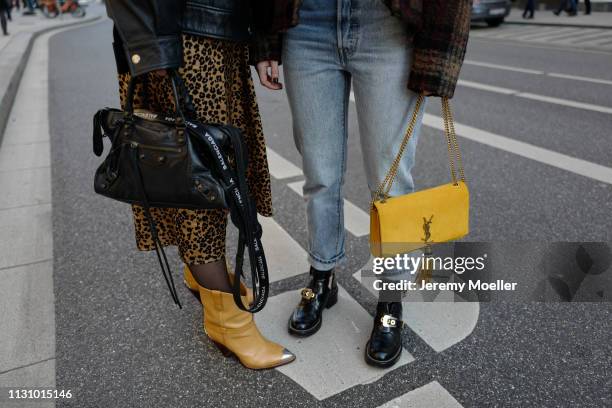 Maike Schmitz and Sonja Paszkowiak wearing Saint Laurent and Balenciaga bag on February 18, 2019 in Hamburg, Germany.