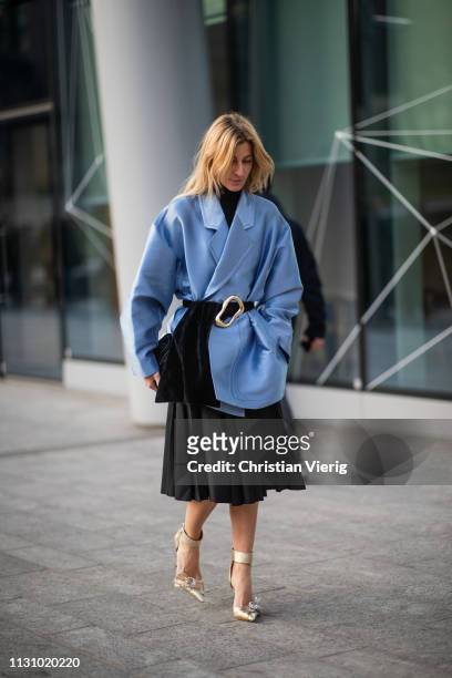 Ada Kokosar is seen wearing blue jacket, black pleated skirt outside Alberta Ferretti on Day 1 Milan Fashion Week Autumn/Winter 2019/20 on February...