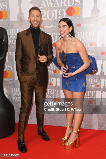 Dua Lipa and Calvin Harris in the winners room during The BRIT Awards 2019 held at The O2 Arena on February 20, 2019 in London, England.