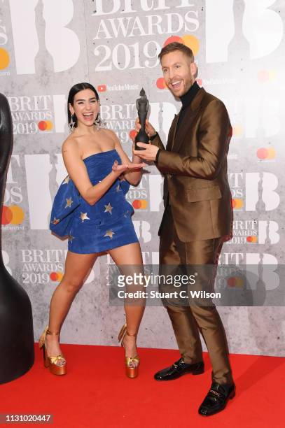 Dua Lipa and Calvin Harris in the winners room during The BRIT Awards 2019 held at The O2 Arena on February 20, 2019 in London, England.