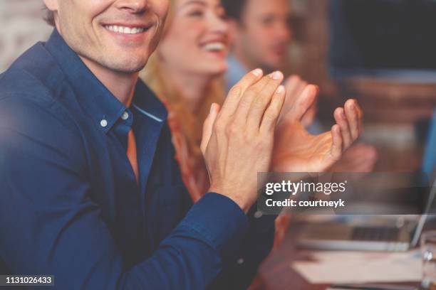 group of business people clapping at a seminar. - clapping hands close up stock pictures, royalty-free photos & images