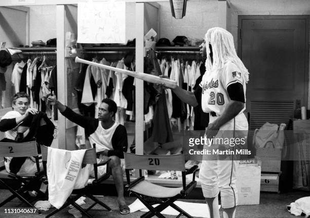 Frank Robinson of the Baltimore Orioles holds the Kangaroo Court, while wearing his judges wig in the locker room, as Paul Blair and Bobby Floyd vote...