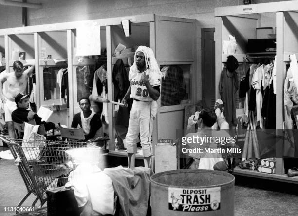 Frank Robinson of the Baltimore Orioles holds the Kangaroo Court, while wearing his judges wig in the locker room, as Bobby Floyd, Paul Blair and...
