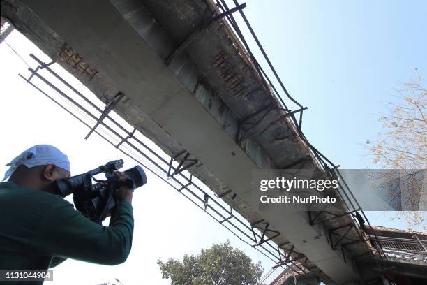 Cameraman shoots a pedestrian bridge connecting a railway station in Mumbai, India on 16 March 2019. As a footbridge collapse, outside the...