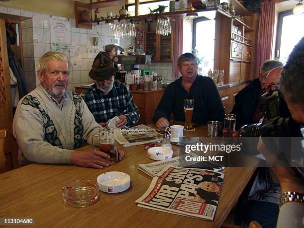 Around a stammtisch, a daily lunch-time gathering around a long table in the Gasthof Oberbrau, locals sit and debate politics, soccer, fishing, and,...