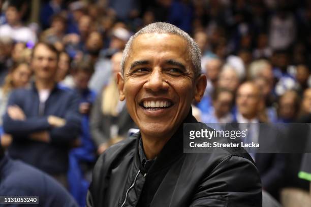 Former President of the United States, Barack Obama, watches on during the game between the North Carolina Tar Heels and Duke Blue Devils at Cameron...